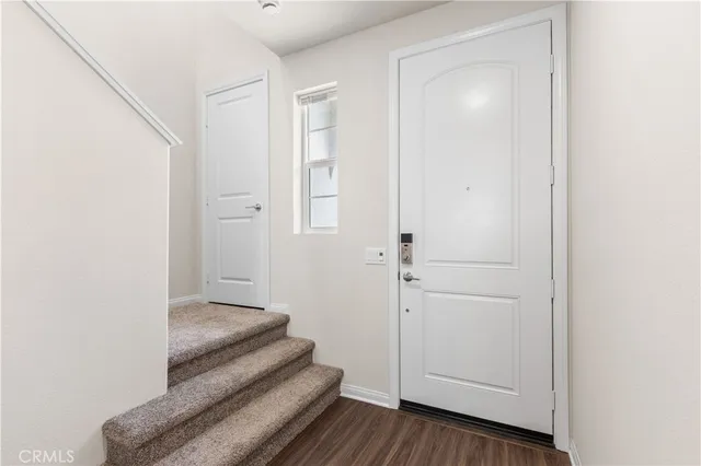a view of a livingroom with wooden floor