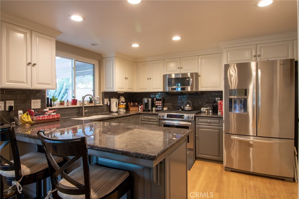 3103 Fish Canyon Road Duarte, CA 91010 - Photo 11 of 20 a kitchen with stainless steel appliances granite countertop a stove refrigerator sink and microwave