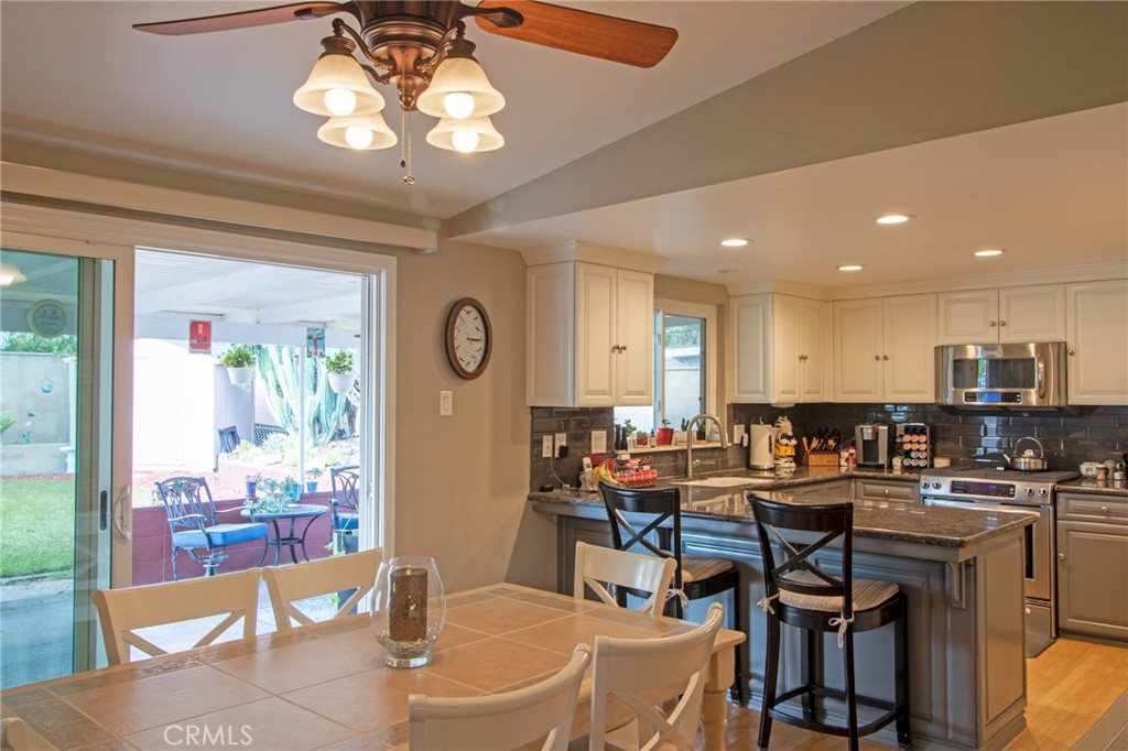 3103 Fish Canyon Road Duarte, CA 91010 - Photo 14 of 20 a view of a dining room with furniture and a chandelier