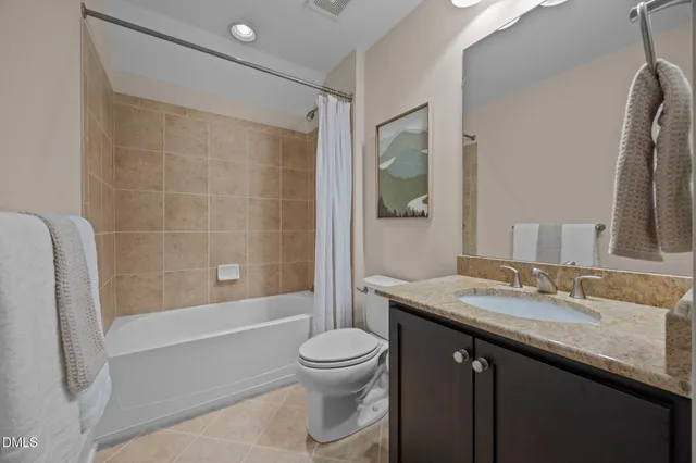 a bathroom with a granite countertop sink a vanity and a mirror