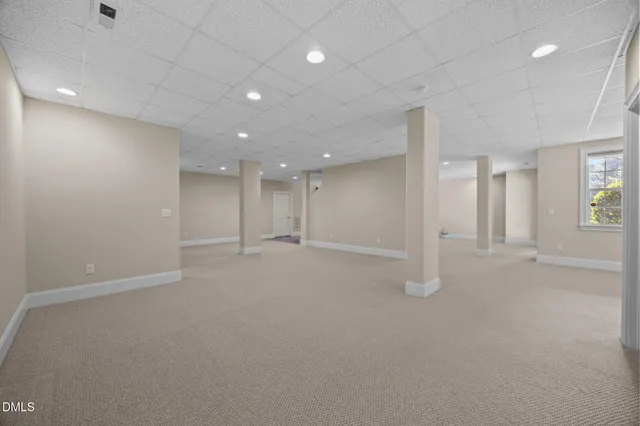 a big room with entryway table and chairs