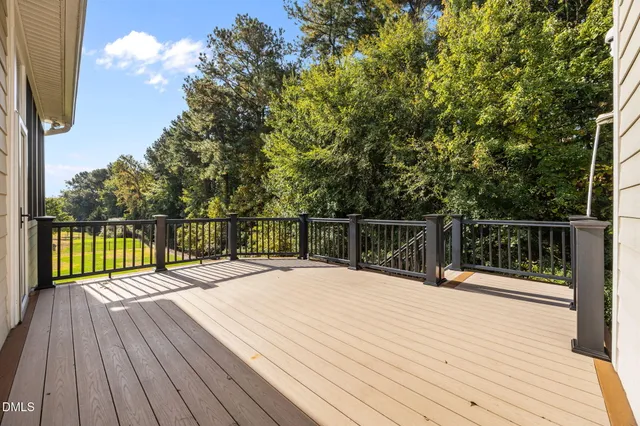 a view of backyard with plants and outdoor seating