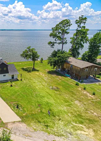 a swimming pool with outdoor seating and garden