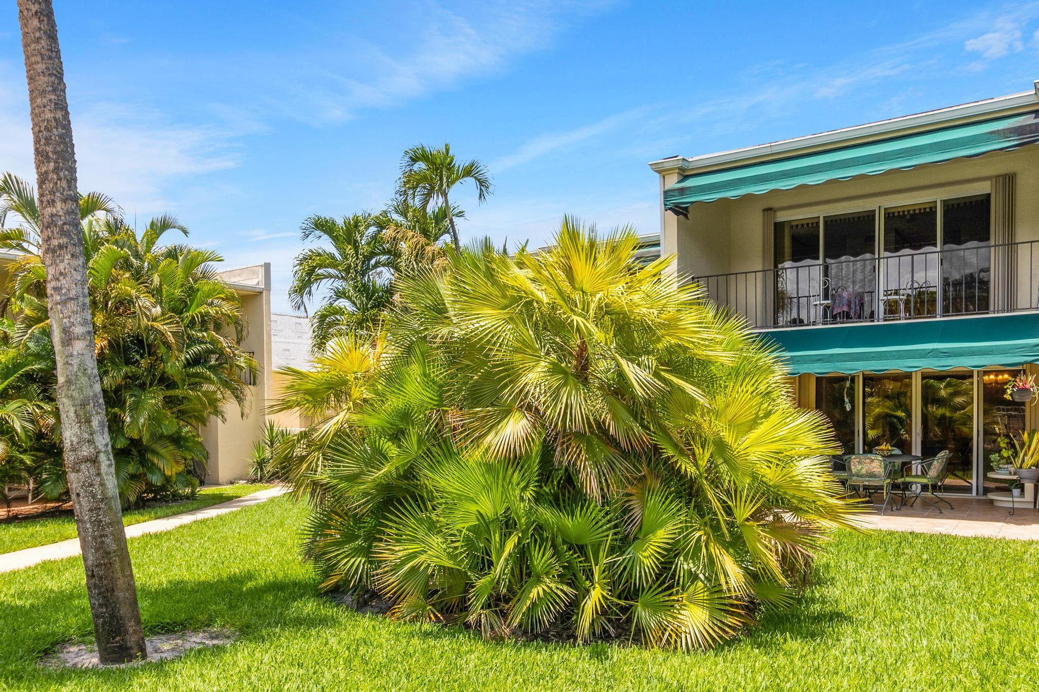 a view of house with backyard