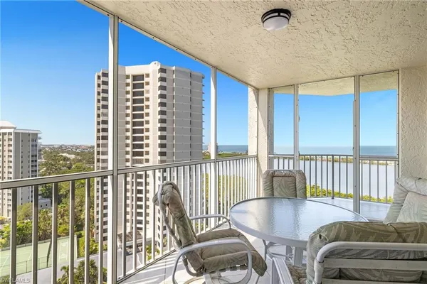 a view of a living room and a balcony