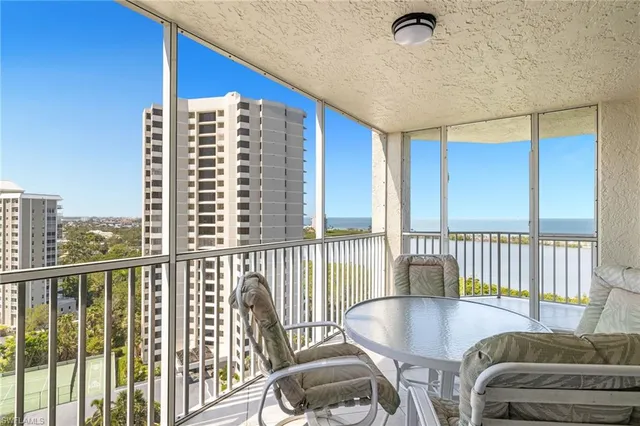 a view of a living room and a balcony