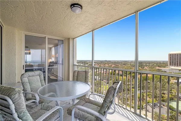 a dining room with furniture window and wooden floor