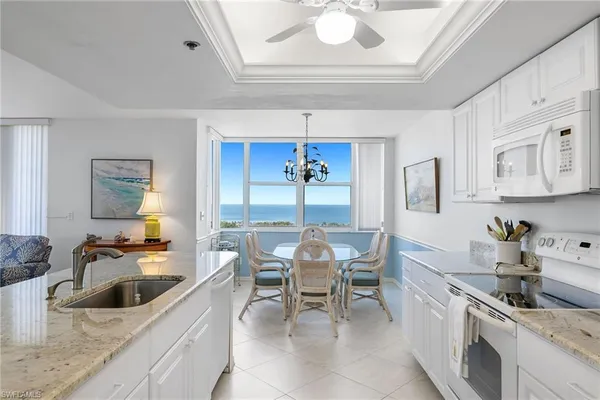 a kitchen with a stove a sink and a refrigerator
