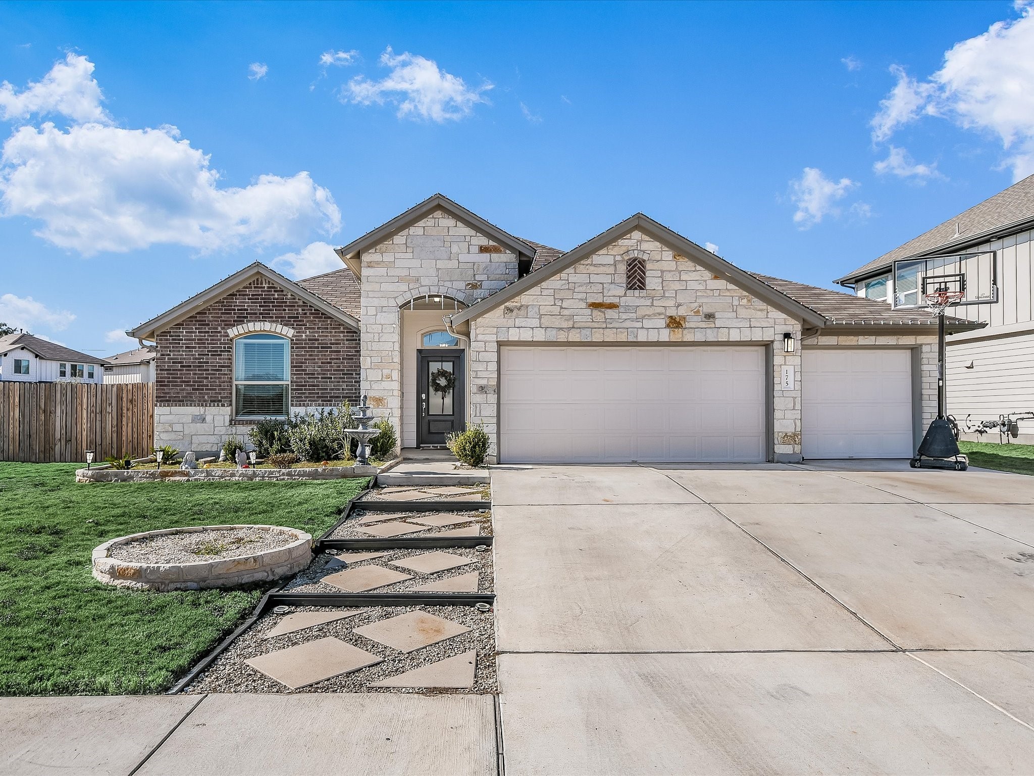 a front view of a house with garden