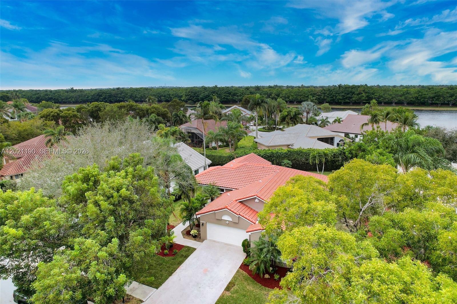 814 Heron Road Weston, FL 33326 - Photo 3 of 27 a view of a lake with outdoor space