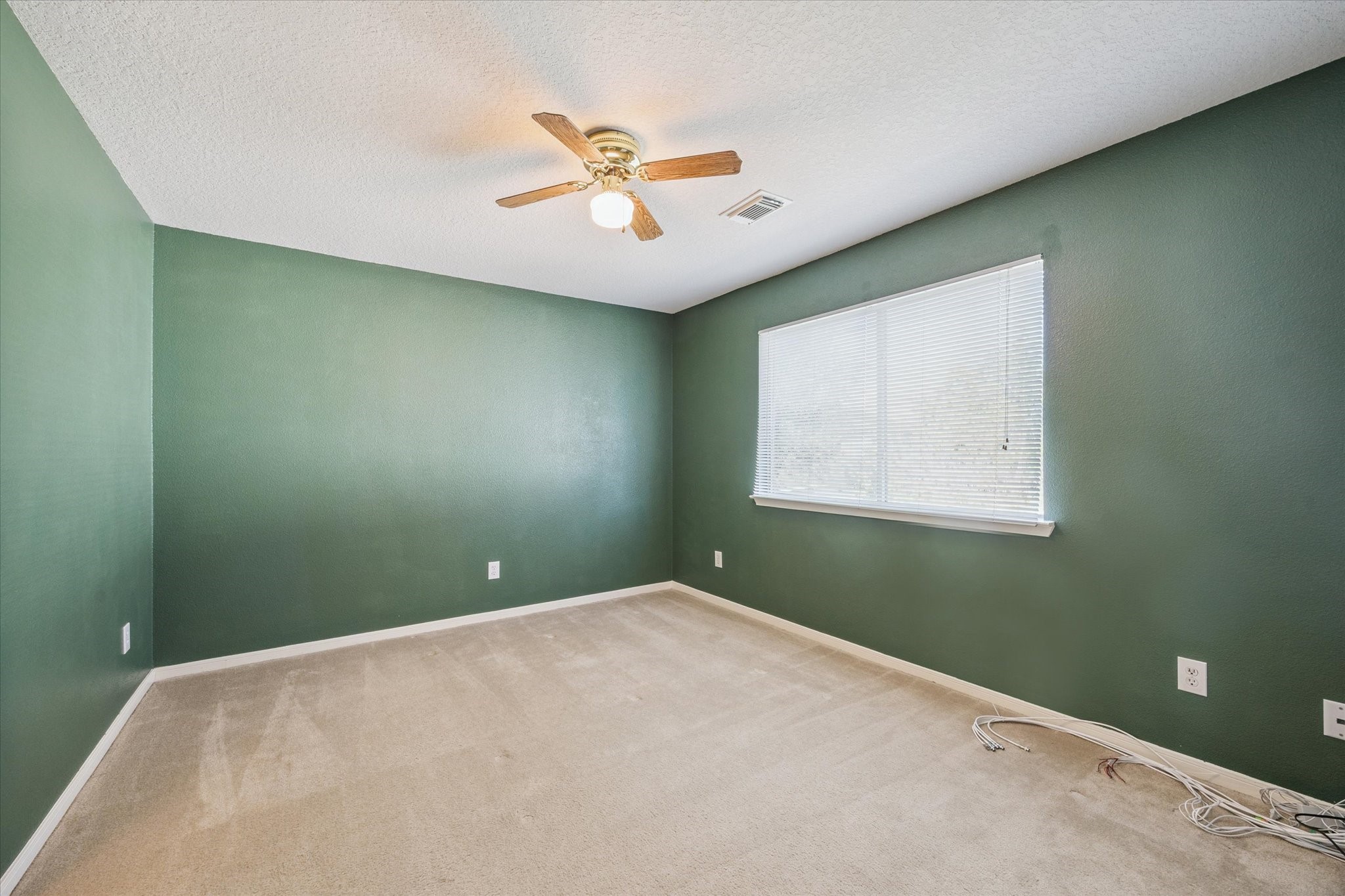 19010 Country Square Drive Houston, TX 77084 - Photo 15 of 23 a view of a ceiling fan and a window