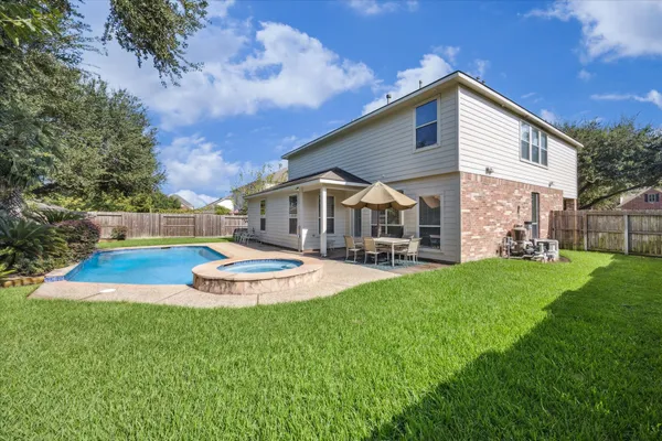 a front view of house with yard and outdoor seating