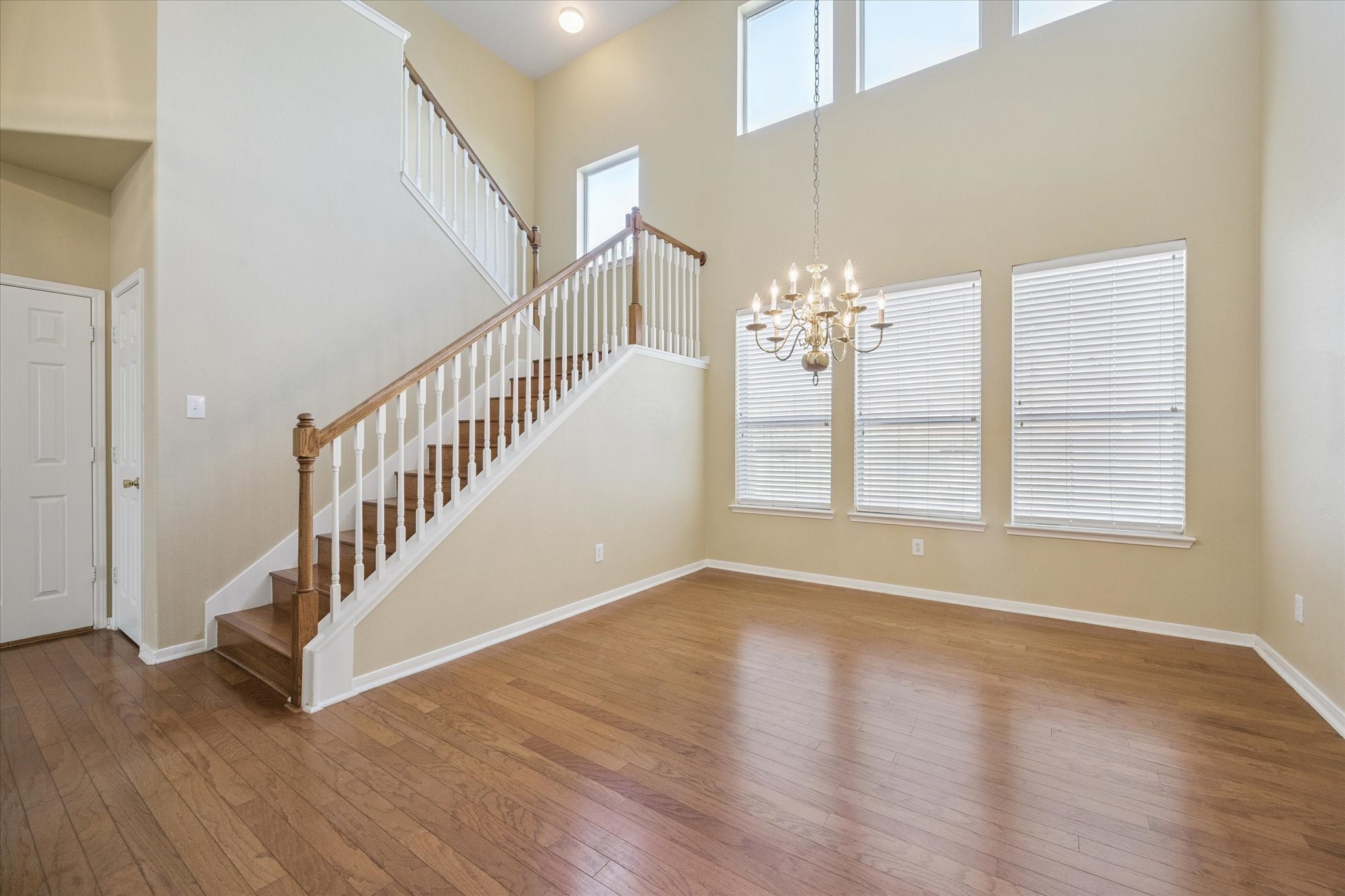 19010 Country Square Drive Houston, TX 77084 - Photo 3 of 23 a view of an empty room with wooden floor and a window
