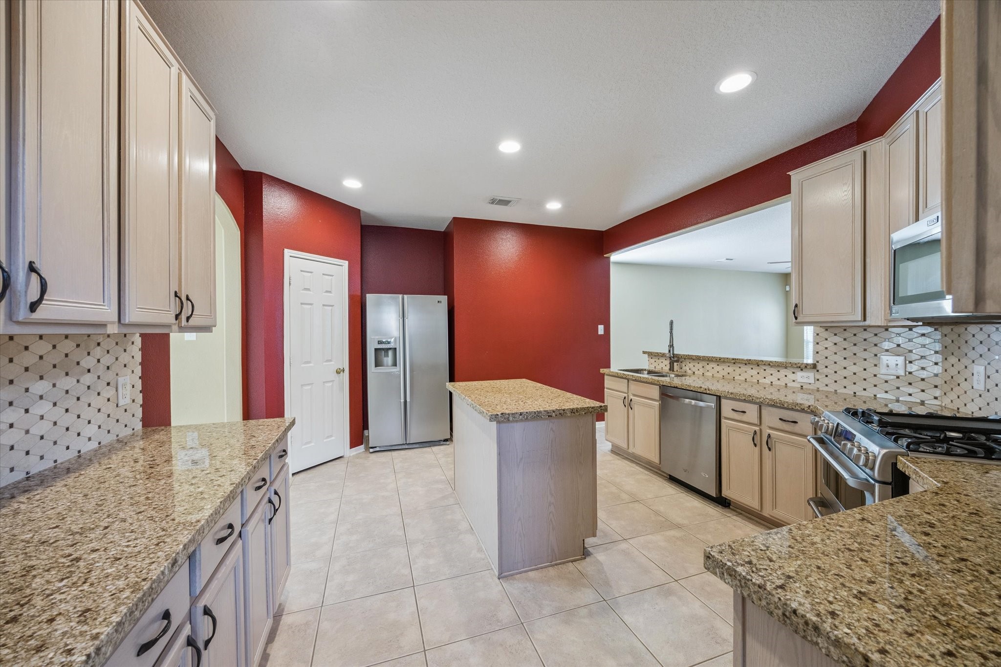 19010 Country Square Drive Houston, TX 77084 - Photo 7 of 23 a large kitchen with stainless steel appliances granite countertop a sink and a refrigerator
