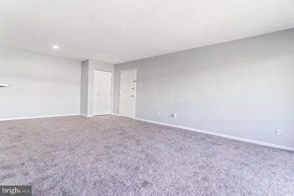 a view of a bathroom from a hallway