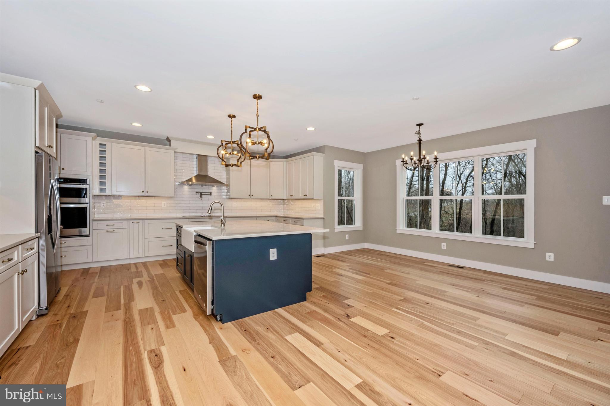 New London Road New Market, MD 21774 - Photo 12 of 68 a large kitchen with kitchen island a sink stainless steel appliances and cabinets
