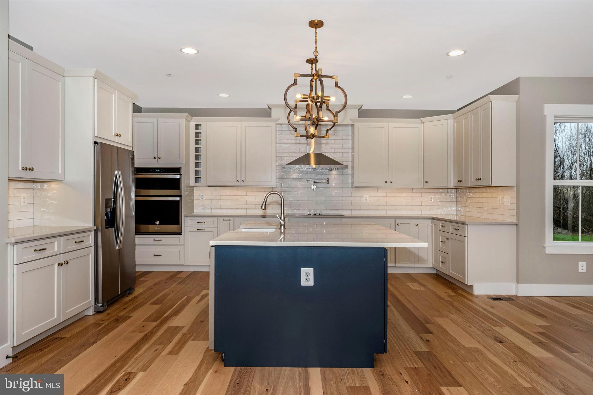 New London Road New Market, MD 21774 - Photo 13 of 68 a kitchen with stainless steel appliances granite countertop a sink stove and refrigerator