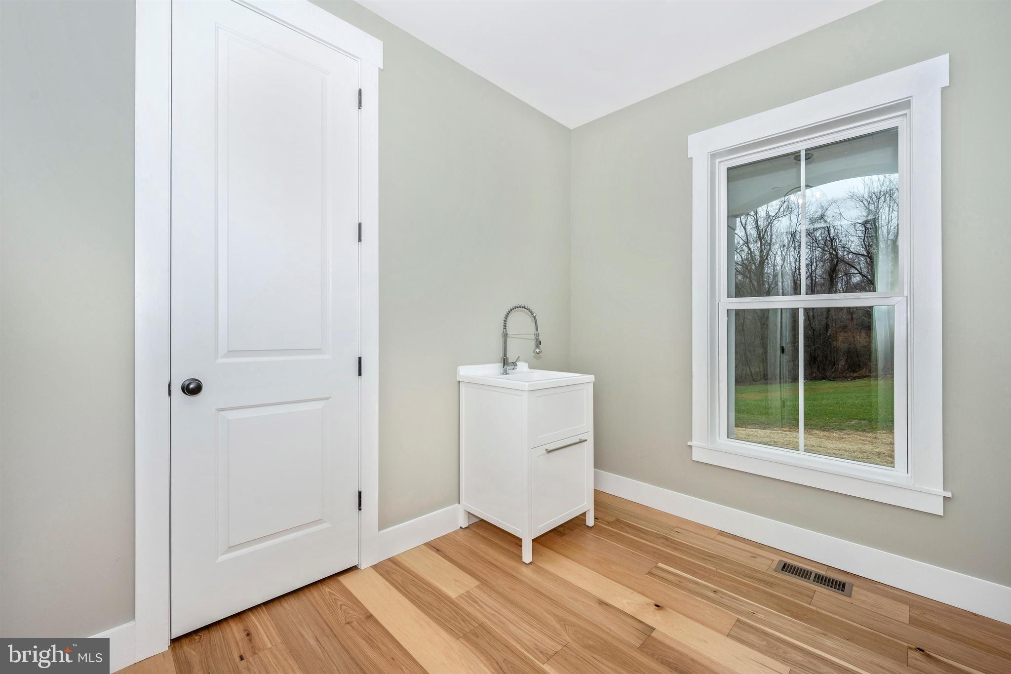 New London Road New Market, MD 21774 - Photo 23 of 68 a view of a room that has a wooden floor and a window