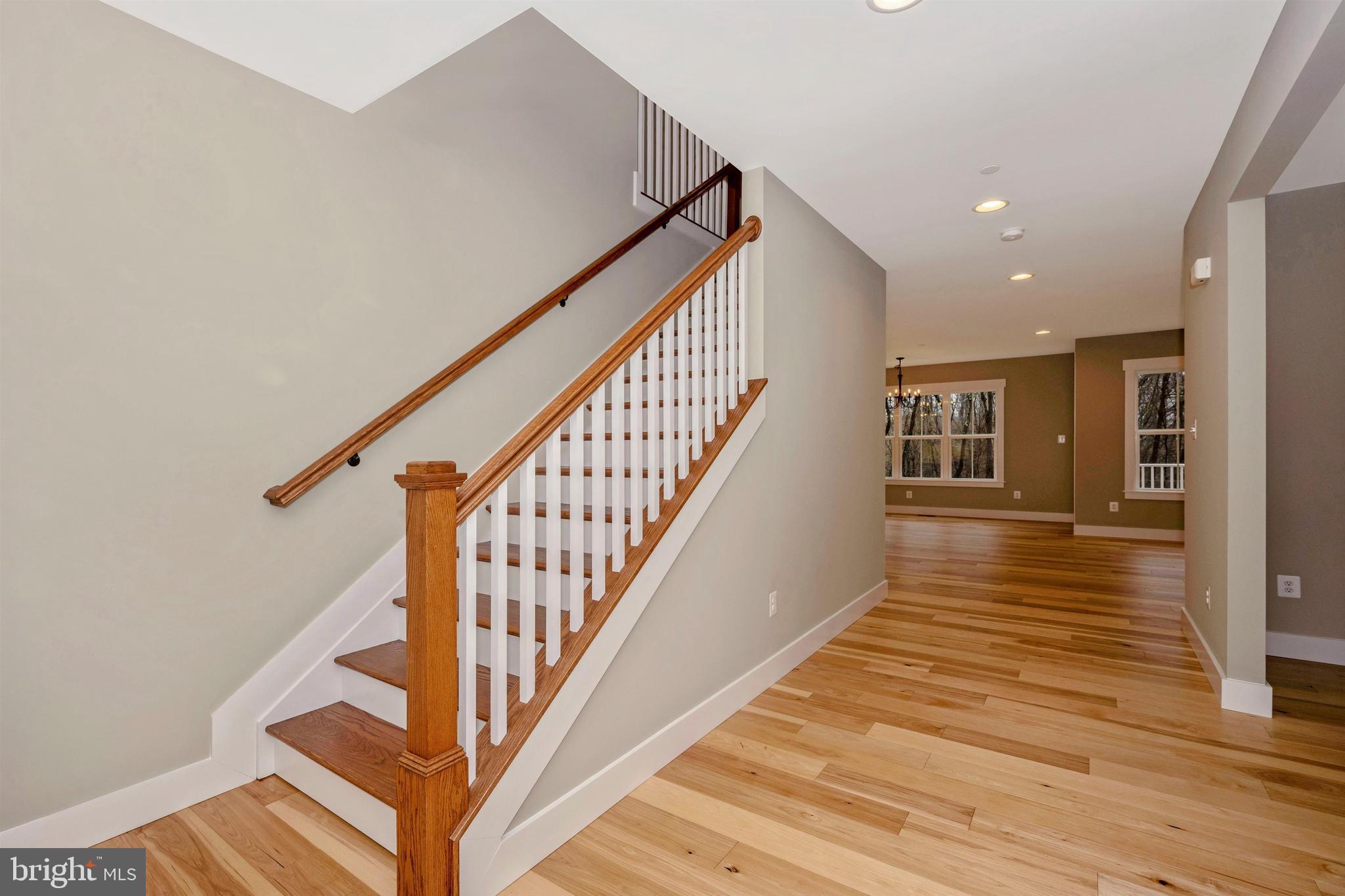 New London Road New Market, MD 21774 - Photo 6 of 68 a view of staircase with lots of frames on wall and wooden floor