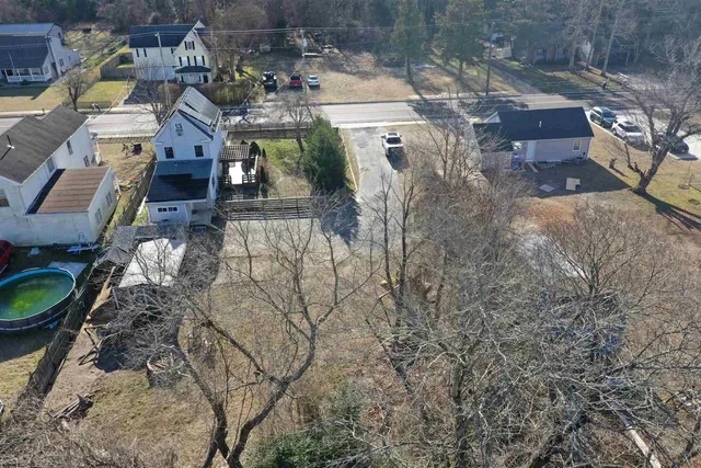 a kitchen with stainless steel appliances granite countertop a sink and a refrigerator