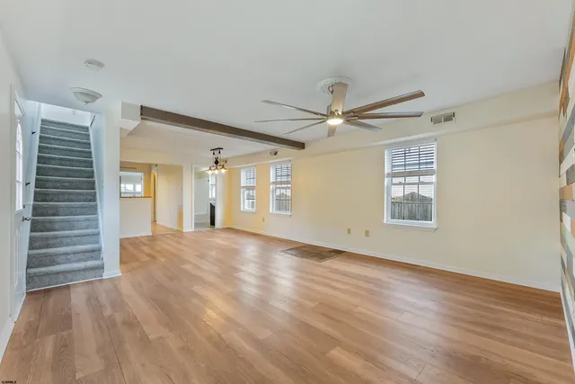 a kitchen with a stove sink and refrigerator