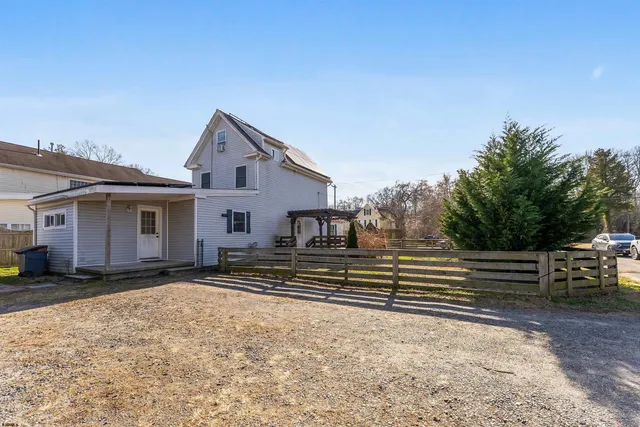 an aerial view of a house with outdoor space