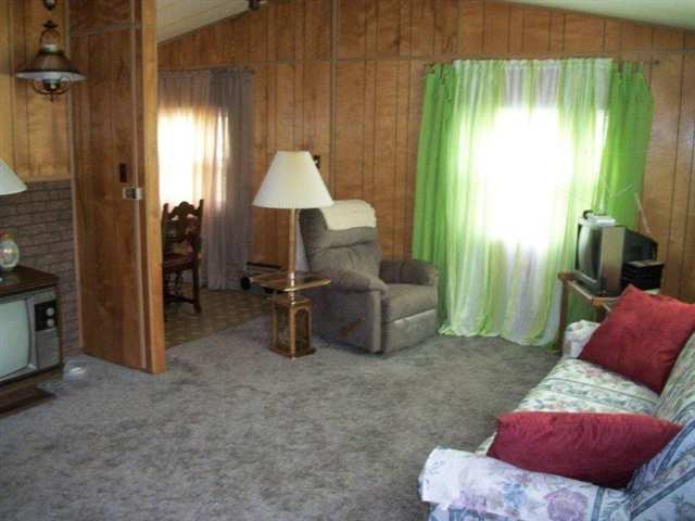 10429 2 Mile Road Thomson, IL 61285 - Photo 4 of 12 a living room with furniture and a large window