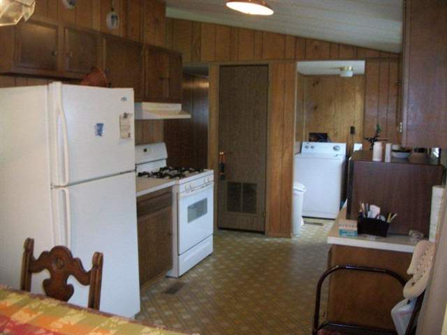 10429 2 Mile Road Thomson, IL 61285 - Photo 5 of 12 a kitchen with a refrigerator and a stove