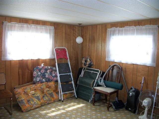 10429 2 Mile Road Thomson, IL 61285 - Photo 10 of 12 a living room with furniture and a window