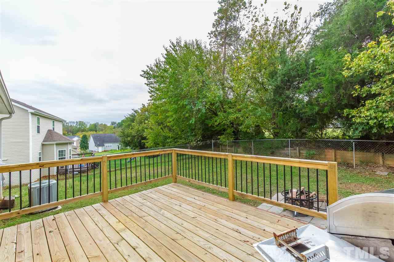 709 Ralph Graham Drive Graham, NC 27253 - Photo 23 of 30 INCREDIBLE deck and lot with border of trees at rear