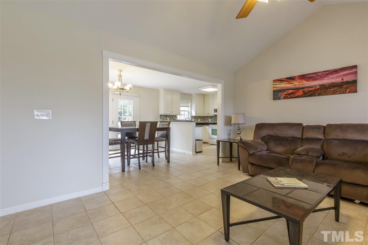 709 Ralph Graham Drive Graham, NC 27253 - Photo 5 of 30 CATHEDRAL CEILING and tile flooring in this spacious family room