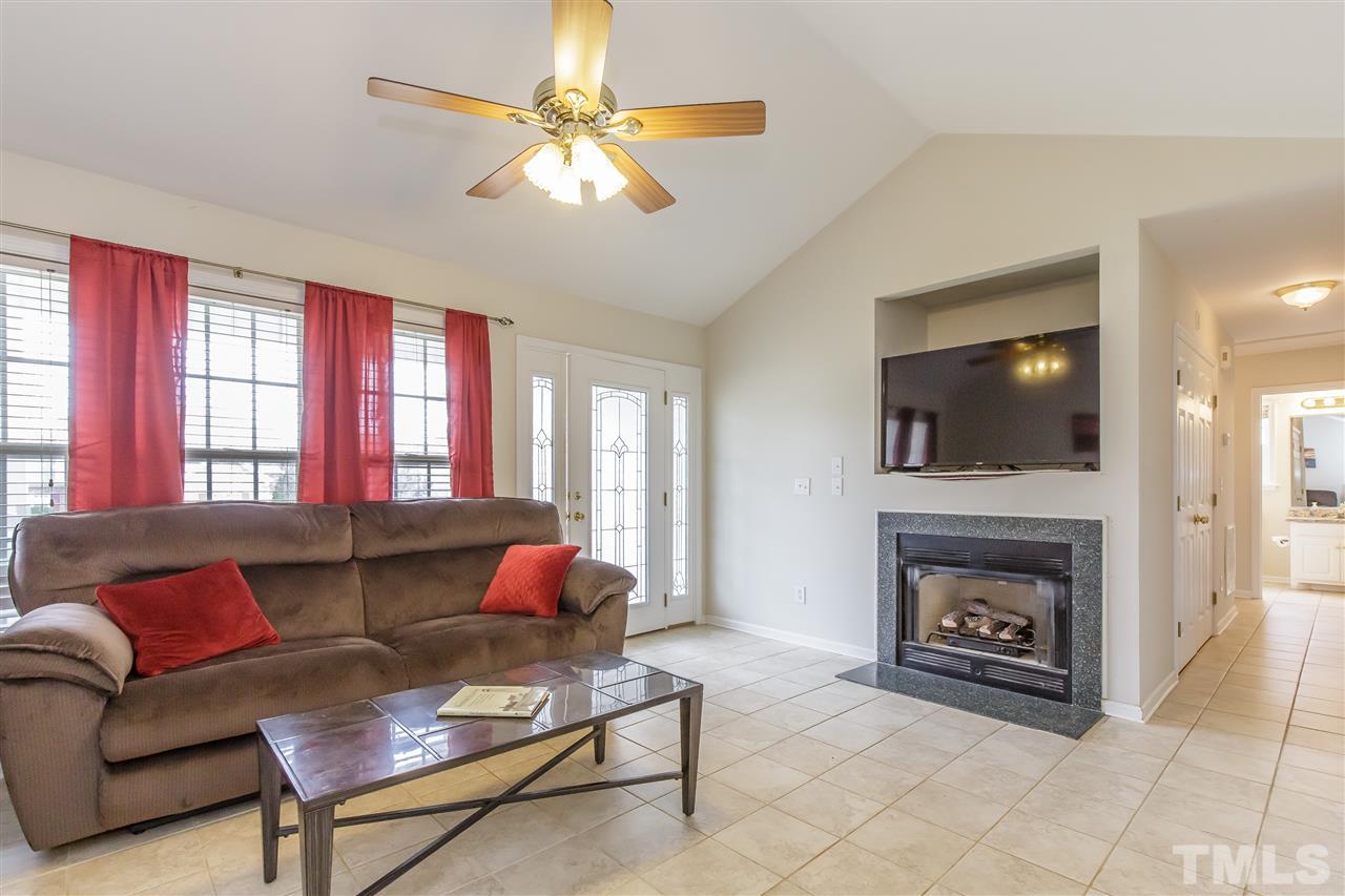 709 Ralph Graham Drive Graham, NC 27253 - Photo 7 of 30 Bright triple window and cozy gas-log fireplace