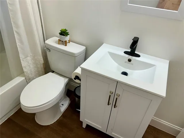 a bathroom with a toilet and a sink