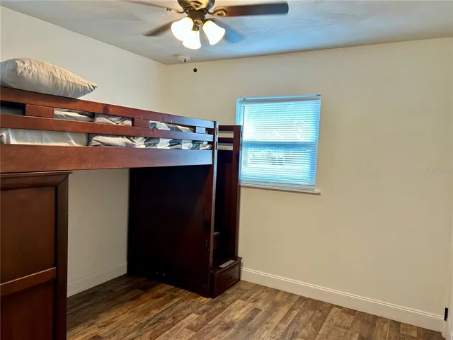 a view of room with a ceiling fan