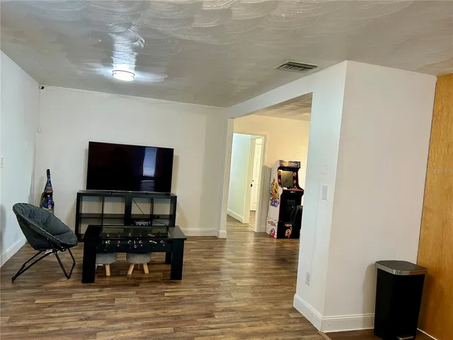 a workspace with furniture window and wooden floor