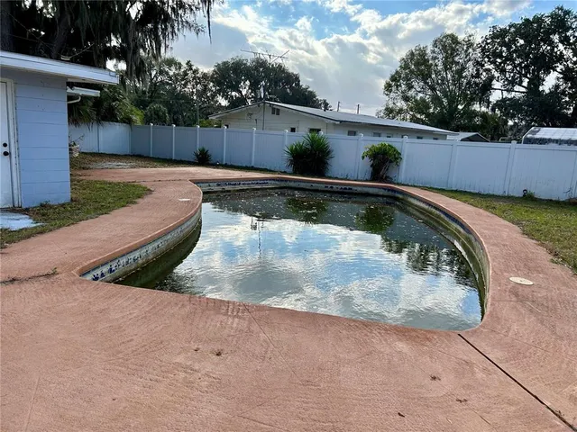 a view of a backyard with a small cabin