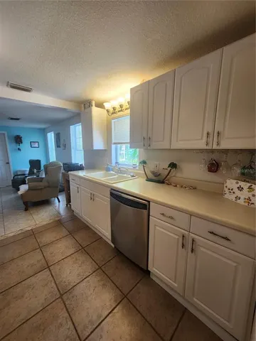 a kitchen with a sink and cabinets