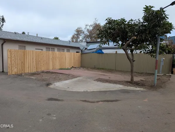 a view of a backyard of a house