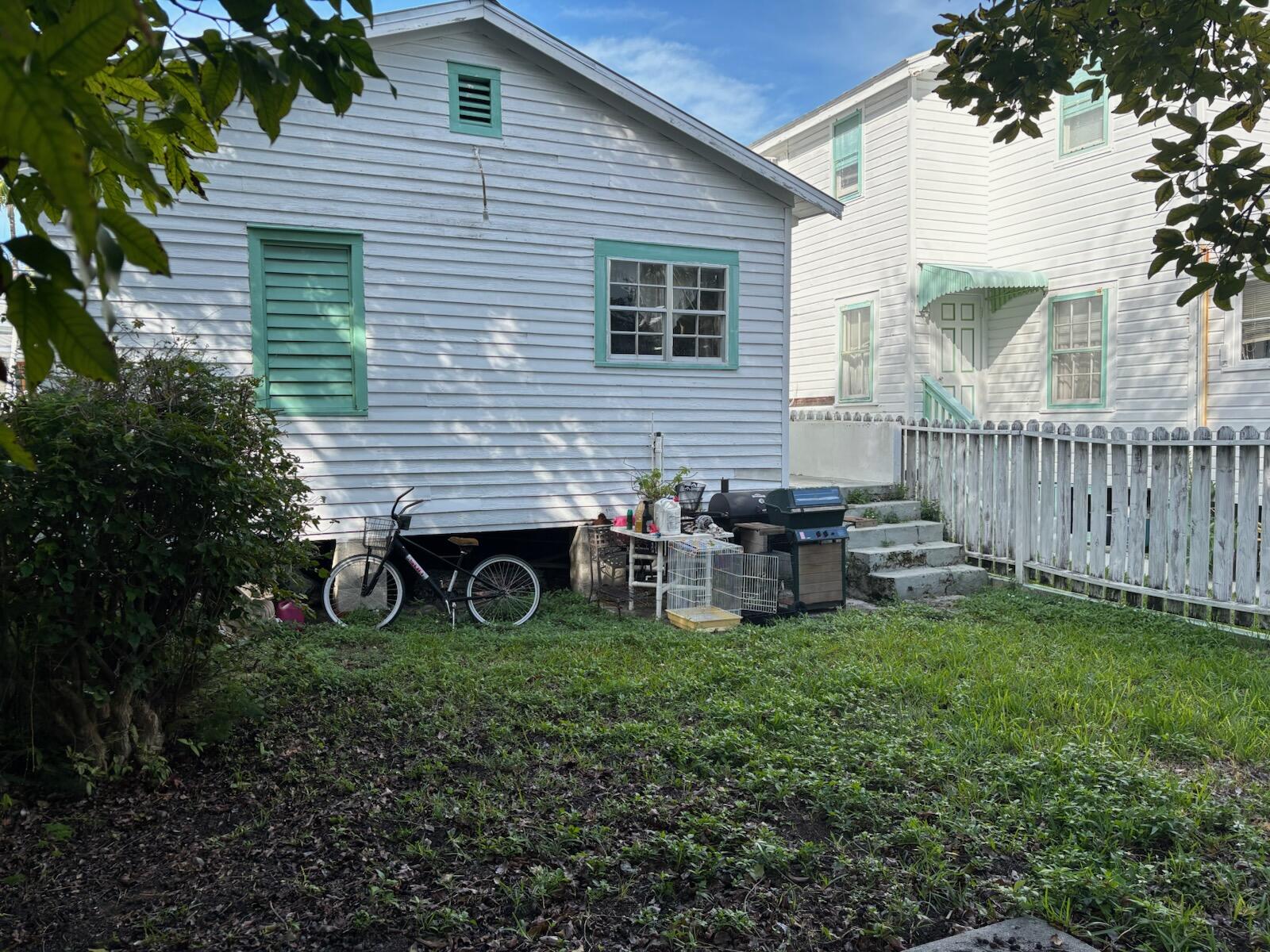 719 Elizabeth Street Key West, FL 33040 - Photo 4 of 15 a view of a house with backyard and sitting area