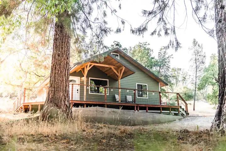 33209 Road 222 North Fork, CA 93643 - Photo 15 of 23 a view of a white house with a yard covered with snow
