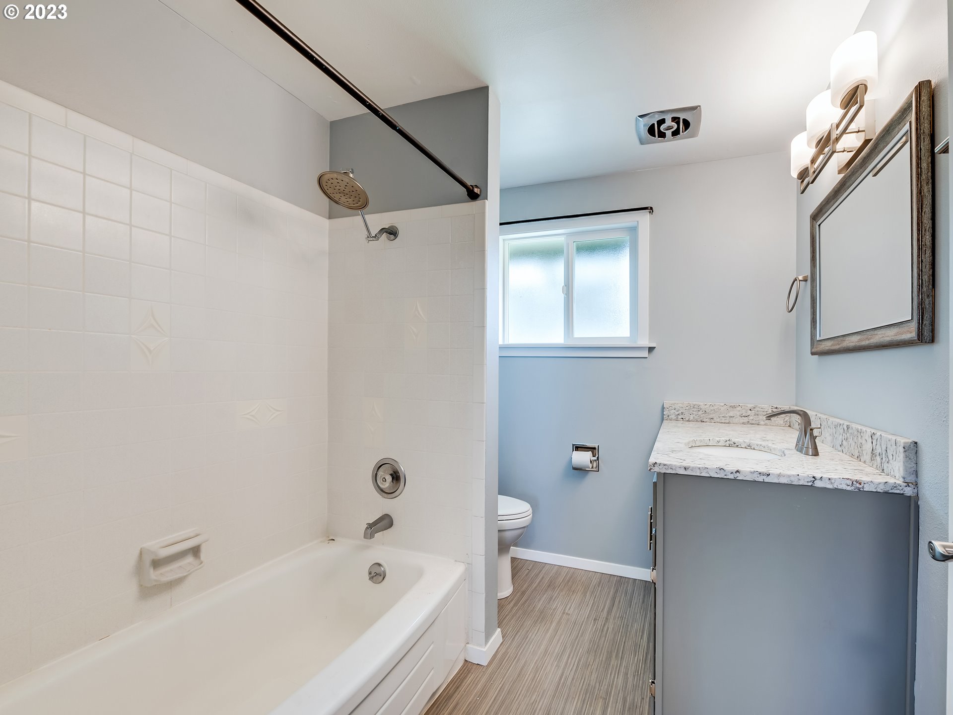 320 36th Street Springfield, OR 97478 - Photo 16 of 26 a bathroom with a tub sink and mirror