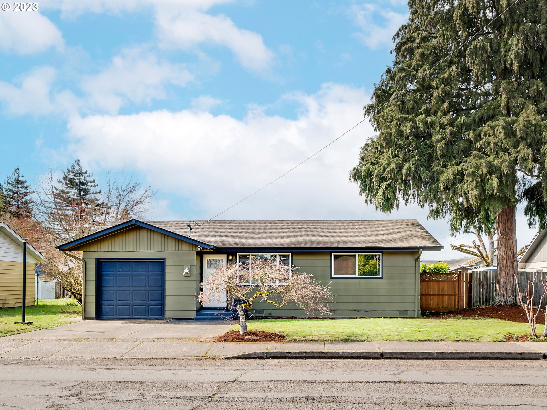 320 36th Street Springfield, OR 97478 - Photo 26 of 26 a front view of a house with a garden and yard