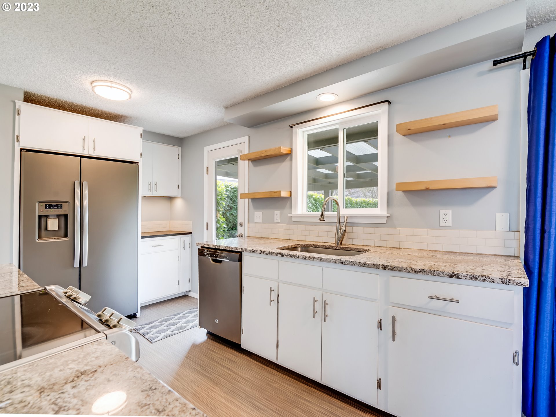 320 36th Street Springfield, OR 97478 - Photo 8 of 26 a kitchen with a sink stove and refrigerator