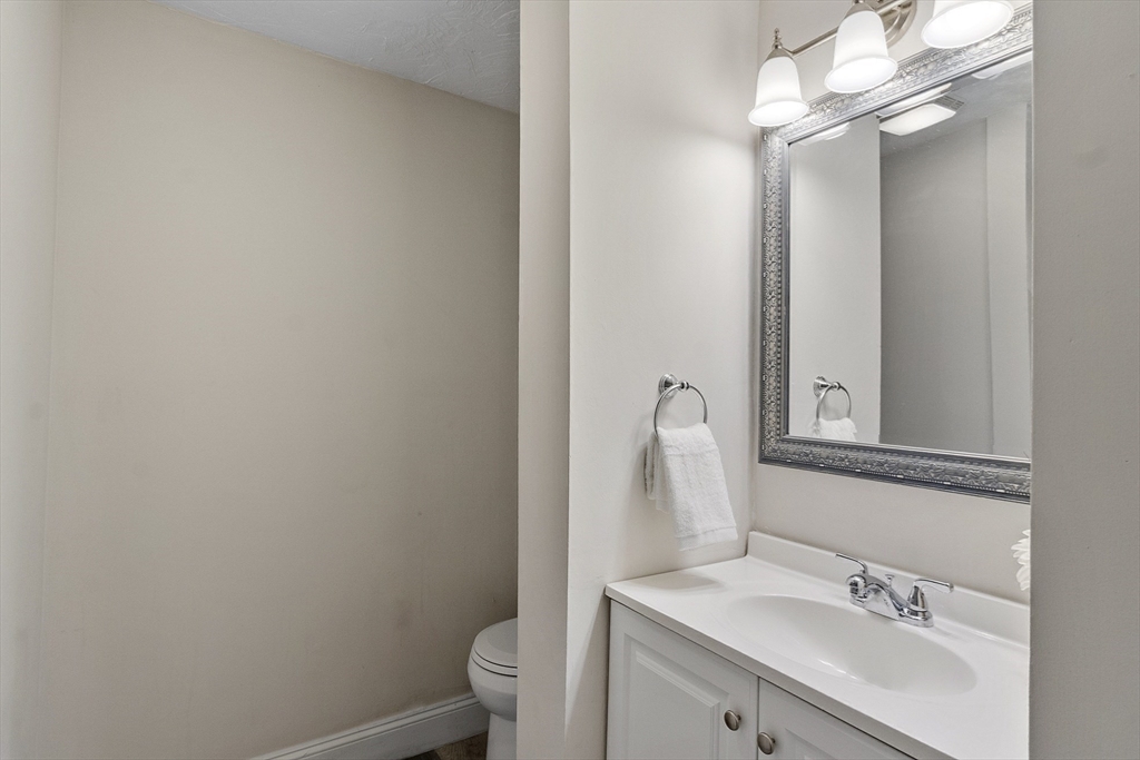 31 Elizabeth Street, Unit G3 Worcester, MA 01605 - Photo 20 of 28 a bathroom with a sink vanity mirror and toilet