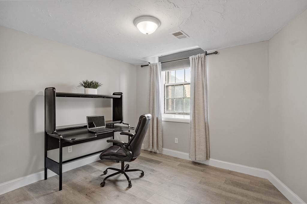 31 Elizabeth Street, Unit G3 Worcester, MA 01605 - Photo 21 of 28 a view of a workspace with furniture and a window