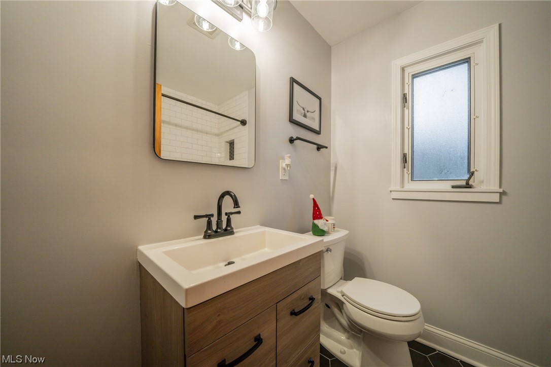 27814 Rexford Road Bay Village, OH 44140 - Photo 6 of 11 Bathroom featuring toilet, tile flooring, and large vanity