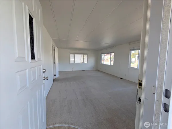 a view of an empty room with a window
