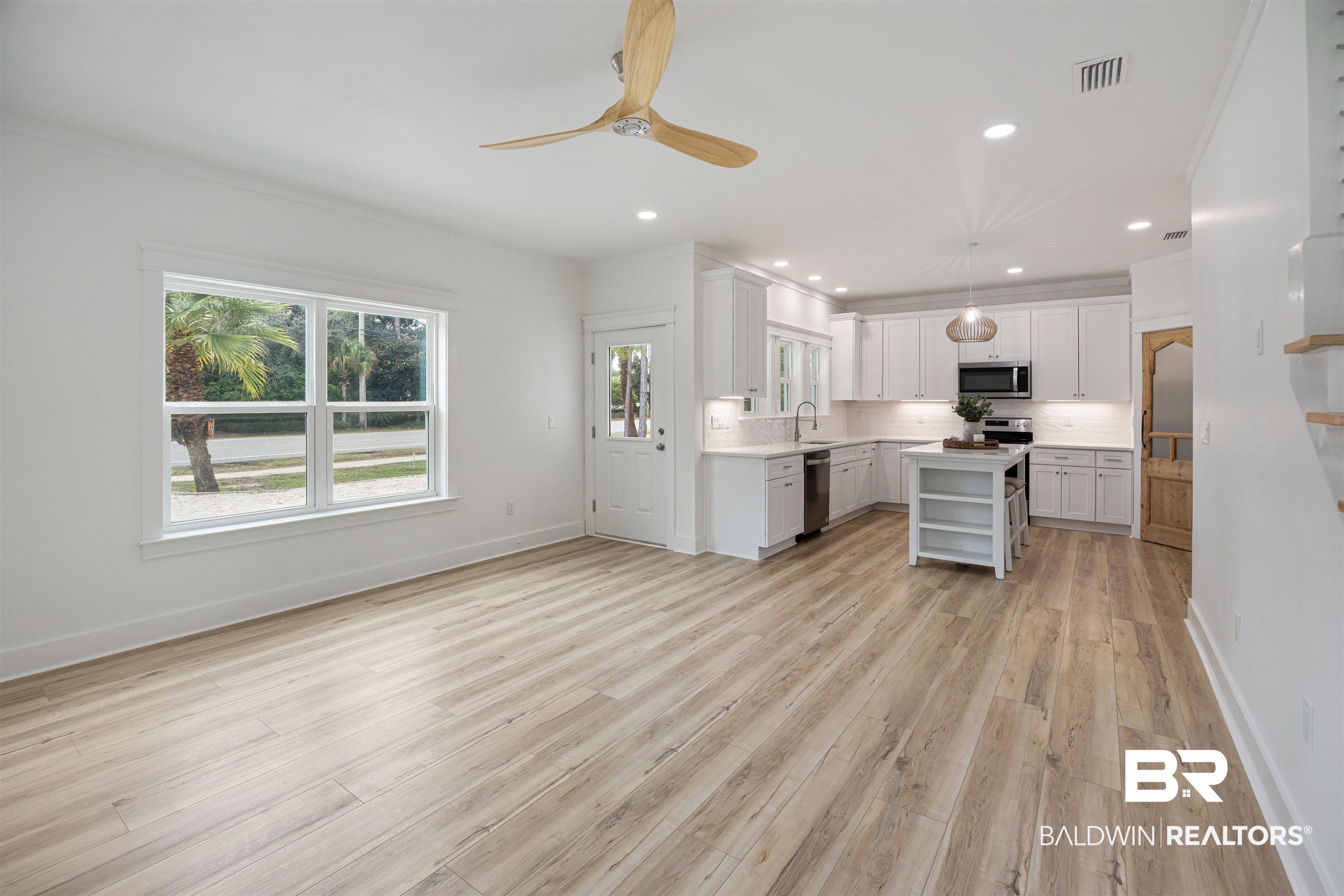 27591 Canal Road Orange Beach, AL 36561 - Photo 9 of 51 Kitchen with open shelves, a kitchen island, decorative light fixtures, recessed lighting, and light wood-style floors