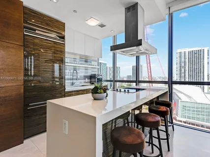 a kitchen with a table and chairs
