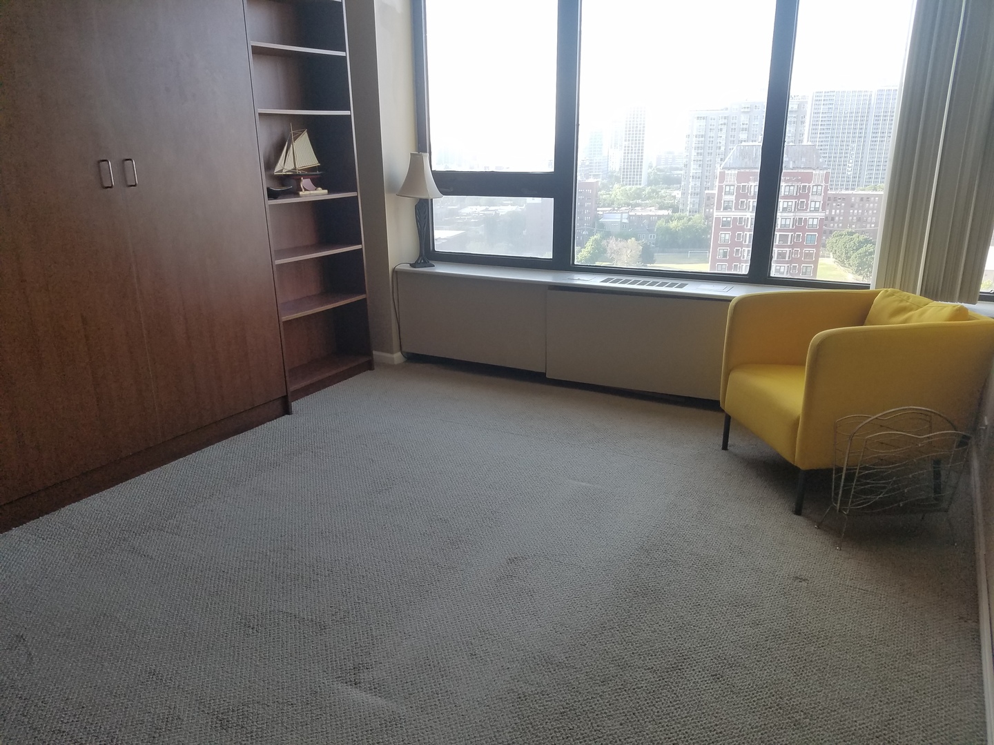 Undisclosed Address Chicago, IL 60613 - Photo 13 of 16 an empty room with a window